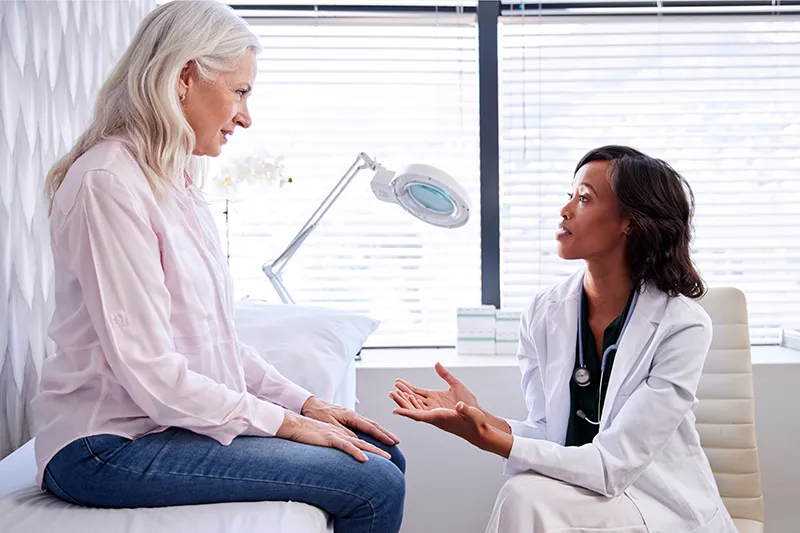 Cahaba Clinical Research - older woman talking with doctor