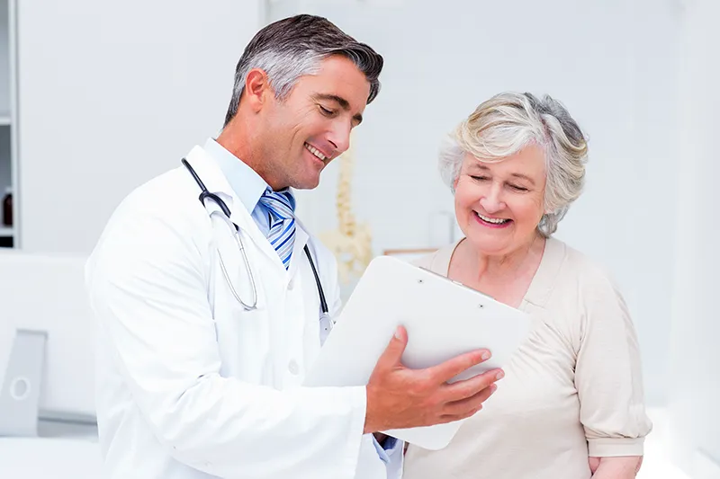 Cahaba Clinical Research - older woman with doctor looking at results